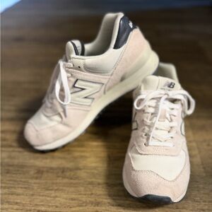 New Balance Women's 574 sneaker in the 'Washed Pink' color way